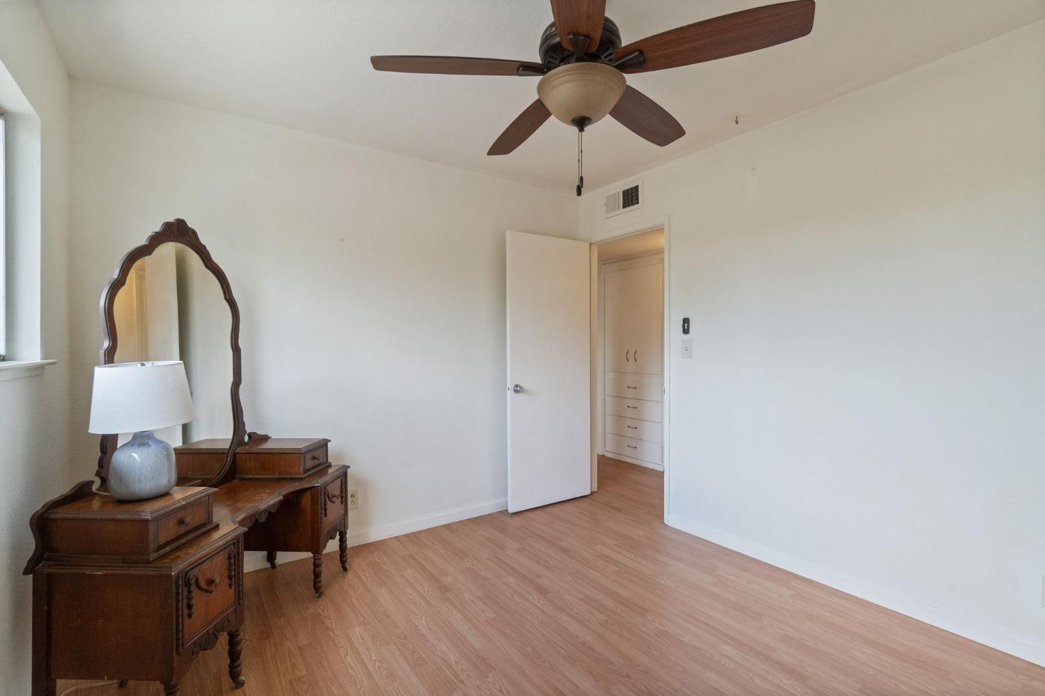 2244 Tivy Valley Road Sanger, CA 93657 - Photo 21 of 44 a view of a workspace with furniture and wooden floor