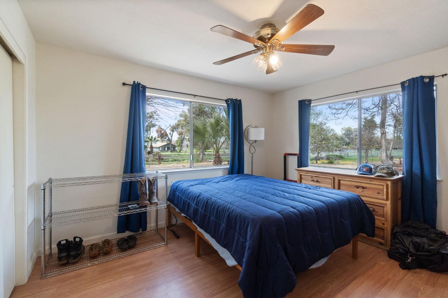 2244 Tivy Valley Road Sanger, CA 93657 - Photo 22 of 44 a bedroom with a bed and a window