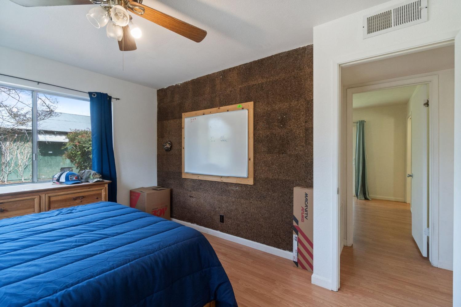 2244 Tivy Valley Road Sanger, CA 93657 - Photo 23 of 44 a bedroom with a bed and a large window