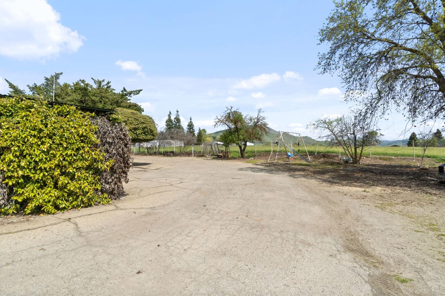 2244 Tivy Valley Road Sanger, CA 93657 - Photo 29 of 44 a view of a road with a yard