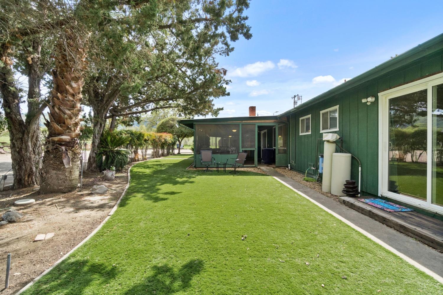 2244 Tivy Valley Road Sanger, CA 93657 - Photo 32 of 44 a view of a house with backyard and sitting area