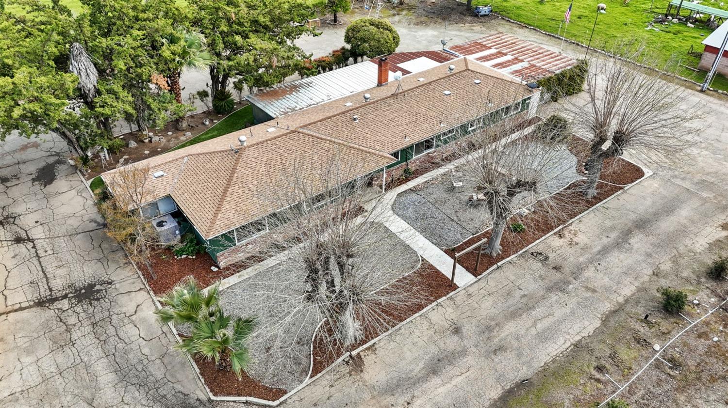 2244 Tivy Valley Road Sanger, CA 93657 - Photo 41 of 44 an aerial view of a house with a yard