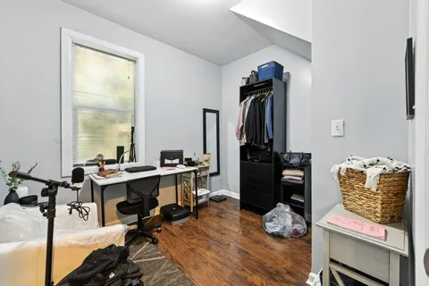 a view of a workspace with furniture and a gate