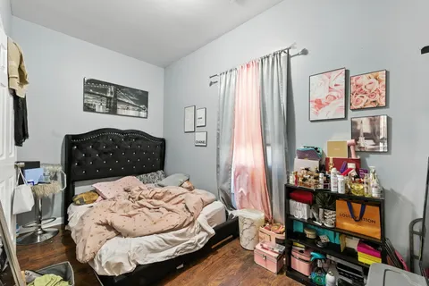 a bedroom with bed and a couch