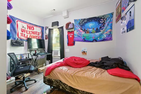 a bedroom with a bed and furniture