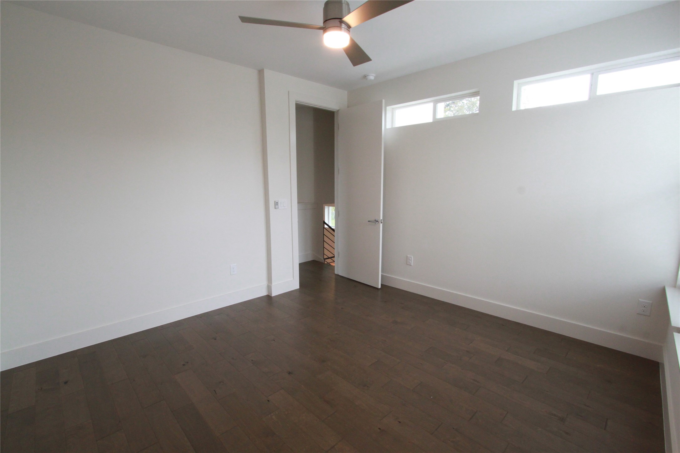 1204 Cometa Street, Unit A Austin, TX 78721 - Photo 20 of 38 Unfurnished room with dark wood-style flooring and ceiling fan