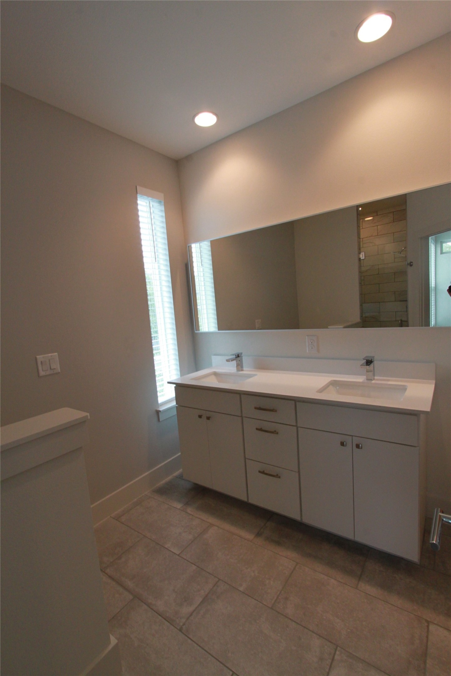 1204 Cometa Street, Unit A Austin, TX 78721 - Photo 22 of 38 Bathroom with double vanity and recessed lighting