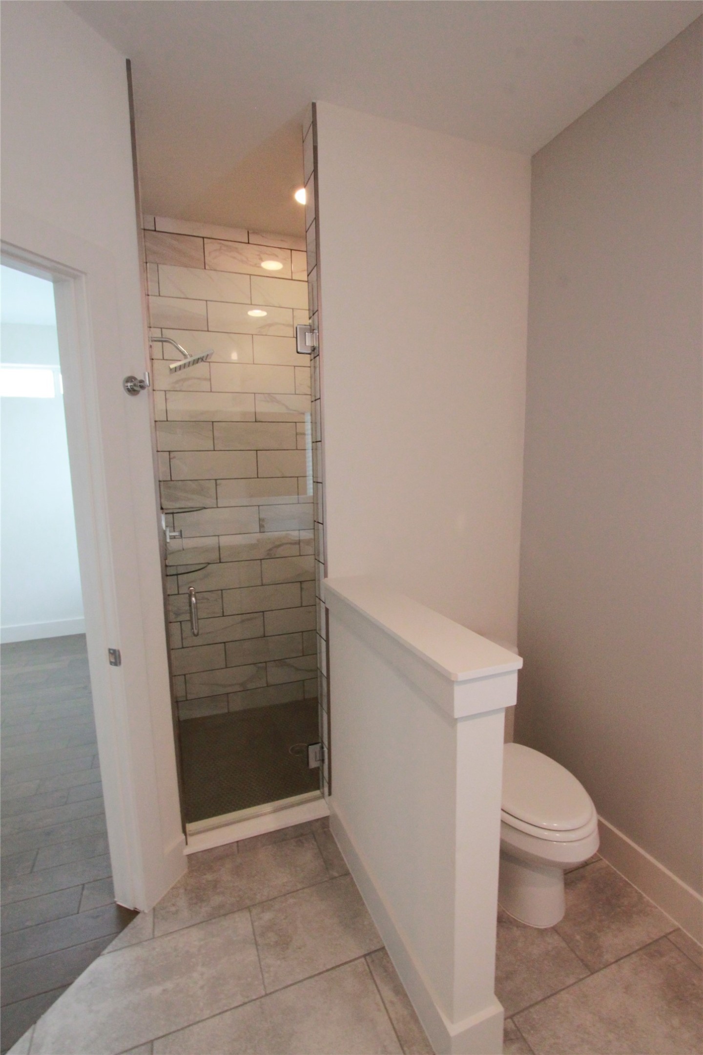 1204 Cometa Street, Unit A Austin, TX 78721 - Photo 23 of 38 Full bathroom with a shower stall and light tile patterned flooring