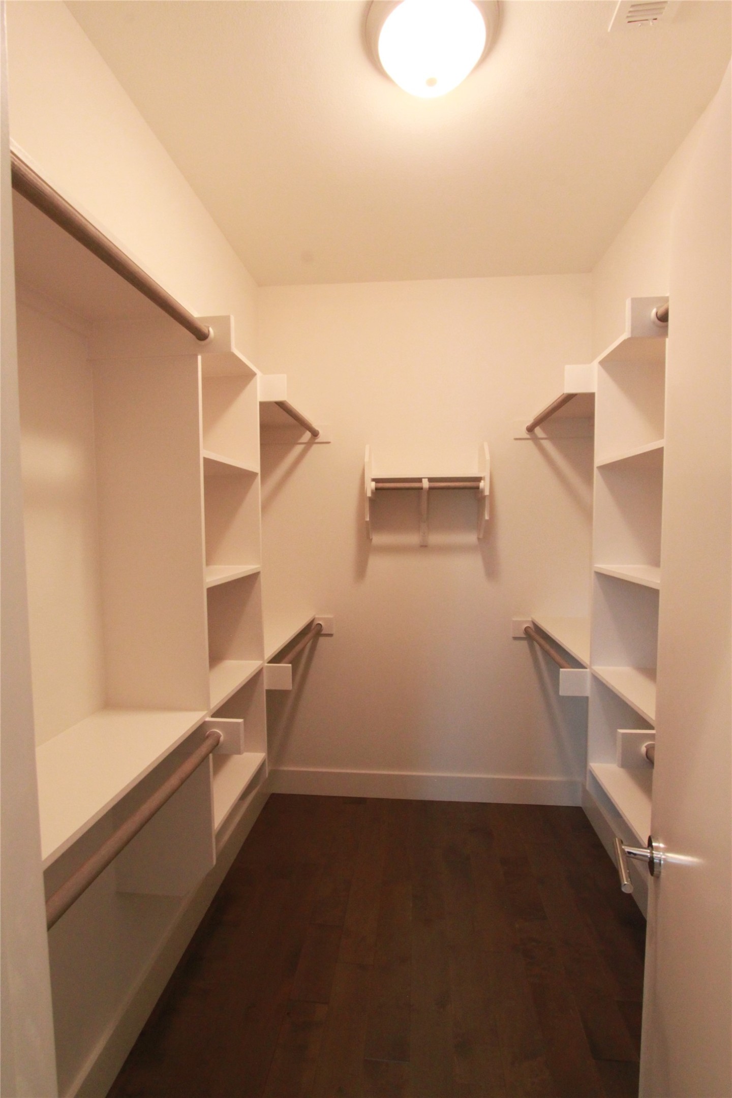 1204 Cometa Street, Unit A Austin, TX 78721 - Photo 25 of 38 Walk in closet featuring dark wood-style floors