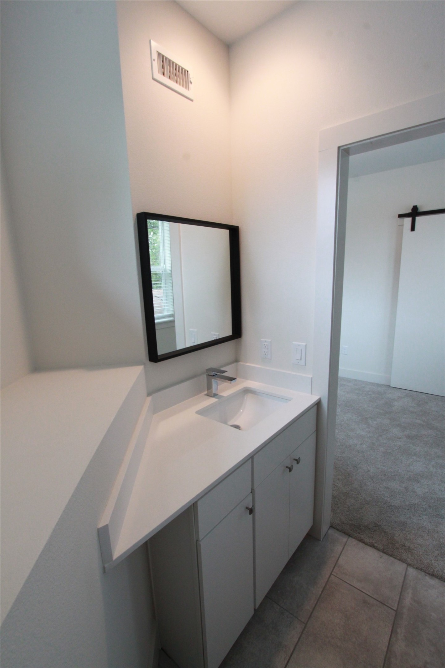 1204 Cometa Street, Unit A Austin, TX 78721 - Photo 31 of 38 Bathroom featuring light colored carpet and vanity