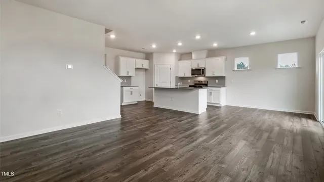 a view of kitchen with wooden floor and window