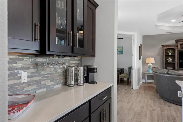 a kitchen with a sink and a refrigerator