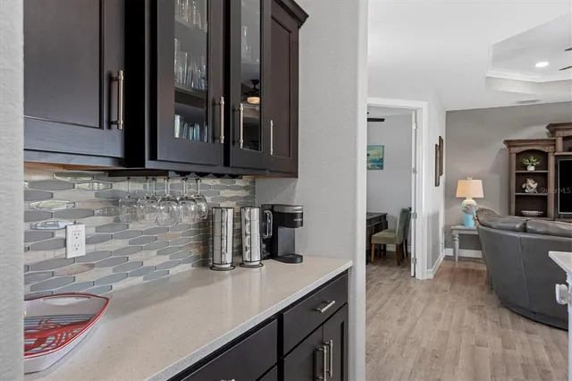a kitchen with a sink and a refrigerator
