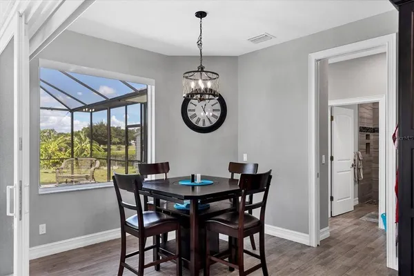 a dining room with furniture window wooden floor