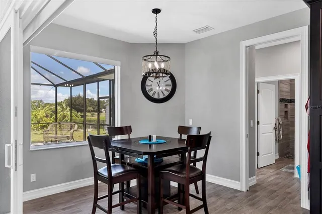 a dining room with furniture window wooden floor