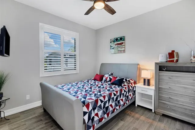 a bedroom with a bed and a dresser