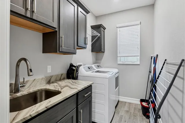a view of storage and utility room with a sink