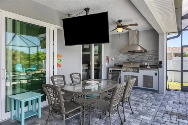 a dining room with furniture and wooden floor