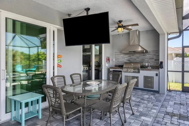 a dining room with furniture and wooden floor