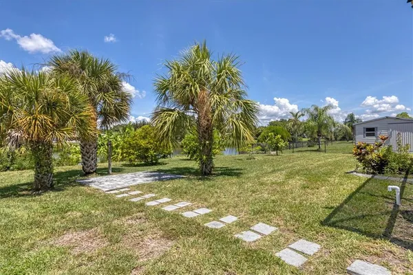 a view of a tree in front of a house
