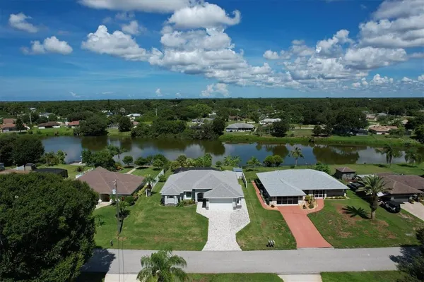 an aerial view of a house with a lake view