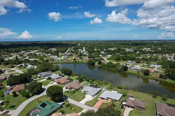 an aerial view of a house with a lake view
