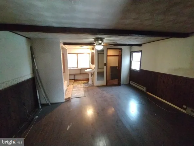 a bathroom with a bathtub and a toilet
