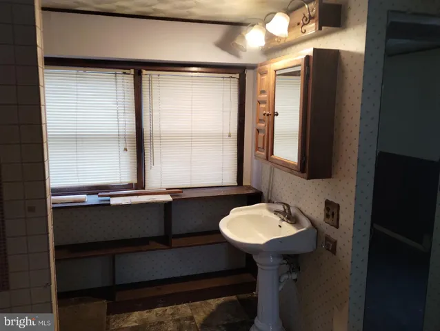 a bathroom with a double vanity sink and mirror