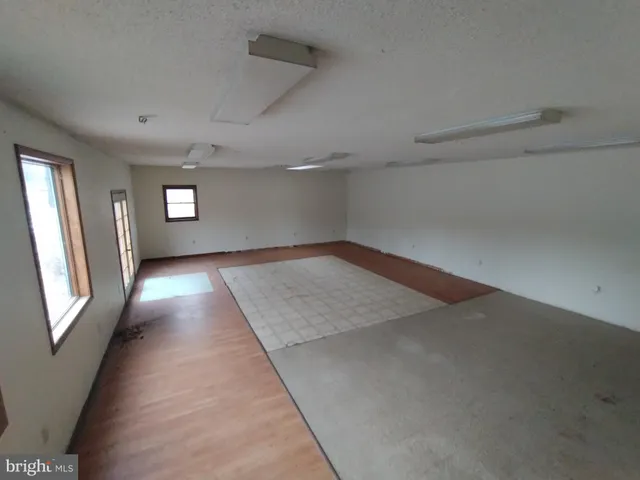 a view of empty room with windows