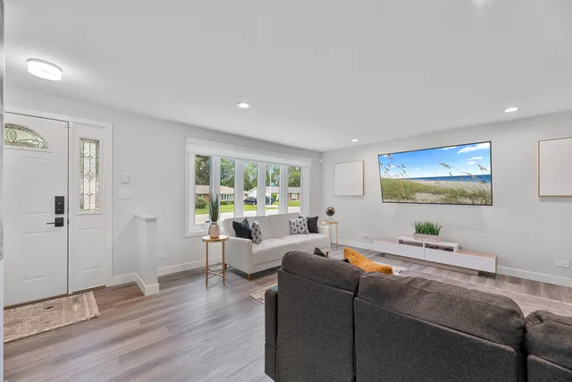 a living room with furniture and a window