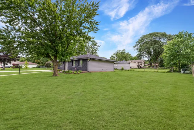a view of a house with a big yard