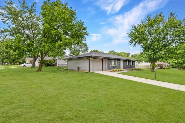 a view of a house with a big yard