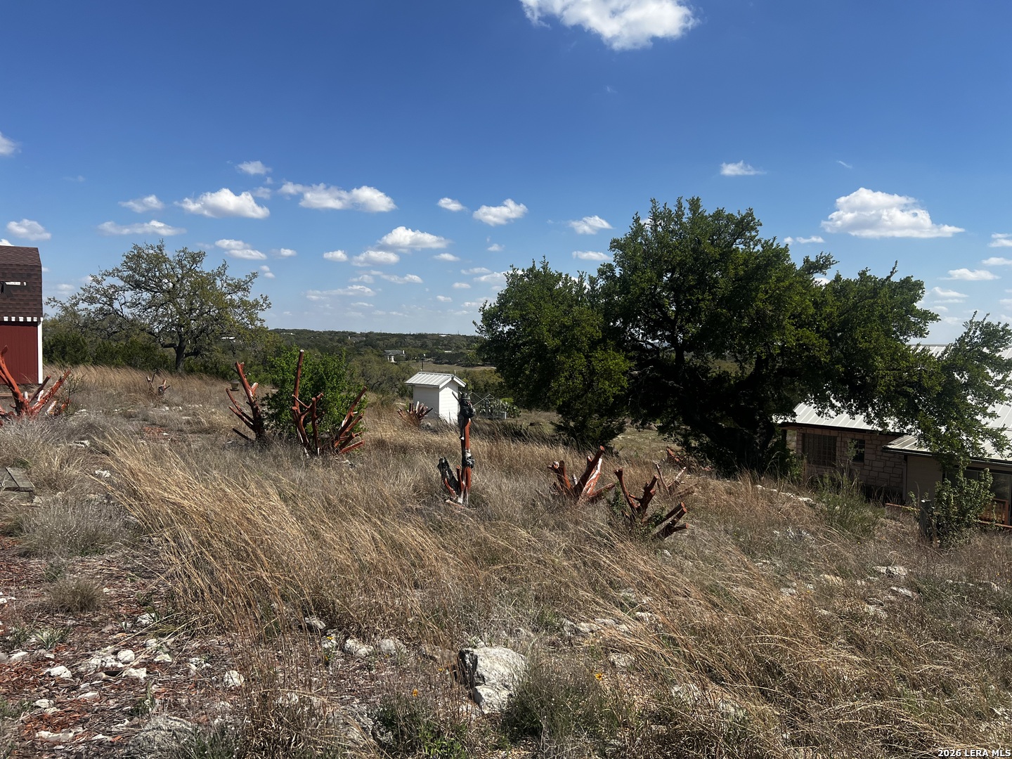 1816 Shepherds Bulverde, TX 78163 - Photo 28 of 32 a backyard of a house with table and chairs with wooden fence