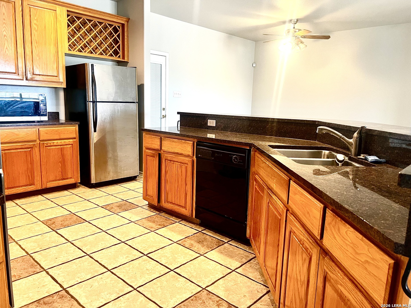 1816 Shepherds Bulverde, TX 78163 - Photo 5 of 32 a kitchen with stainless steel appliances granite countertop a refrigerator and a stove