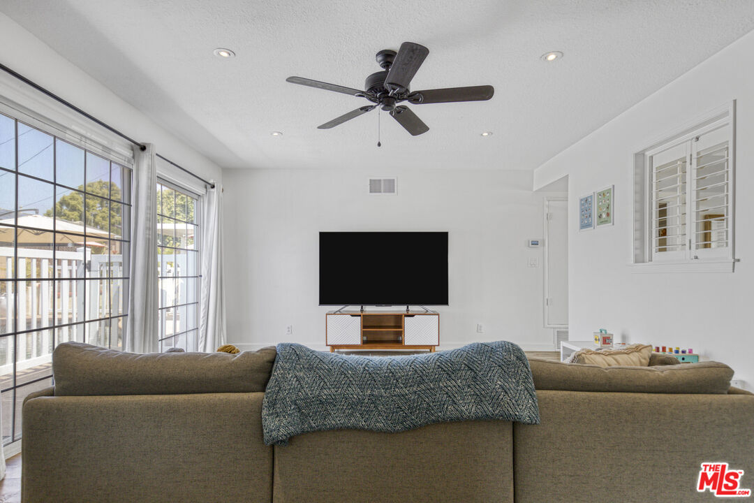 2735 Beth Place Simi Valley, CA 93065 - Photo 12 of 31 a living room with furniture and a flat screen tv