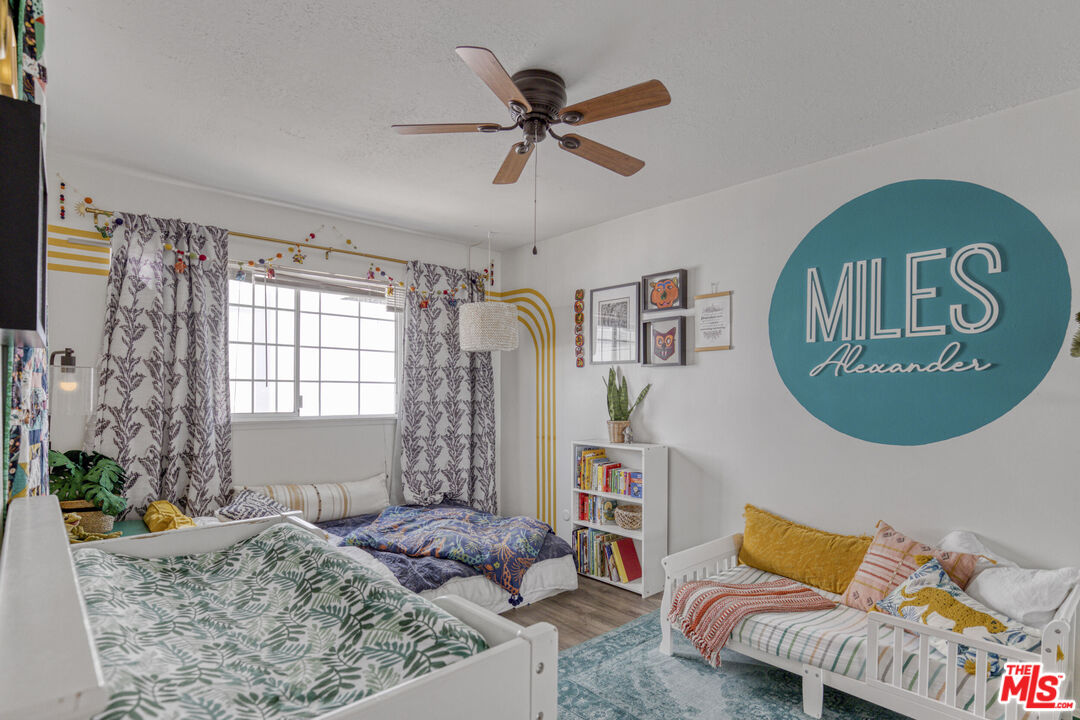 2735 Beth Place Simi Valley, CA 93065 - Photo 22 of 31 a bed room with a bed and a couch