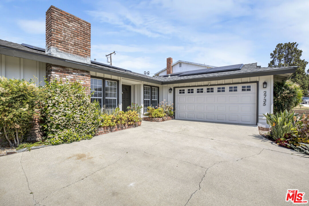 2735 Beth Place Simi Valley, CA 93065 - Photo 4 of 31 a view of a house with a yard and potted plants