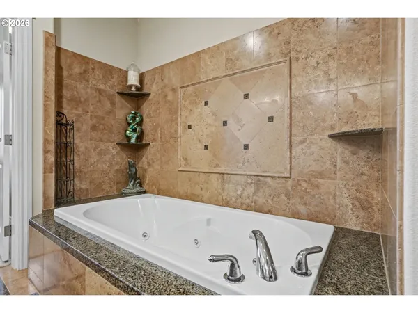a bathroom with a bathtub and shower