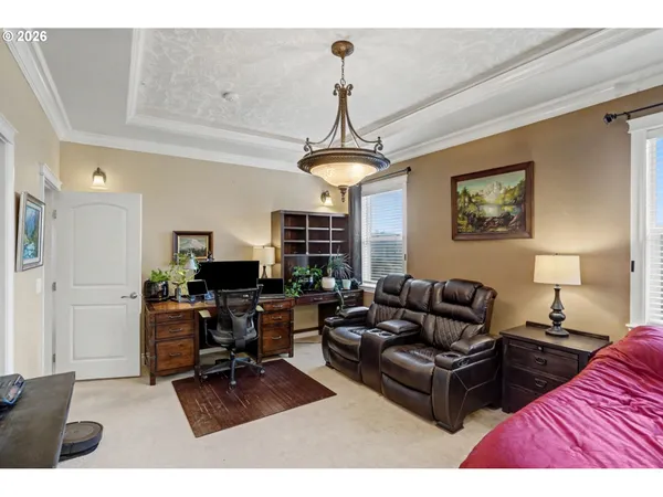 a living room with furniture a rug and a window