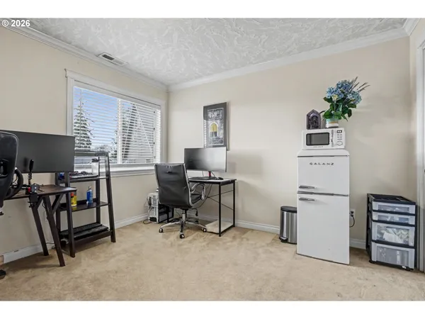 a workspace with furniture and a window