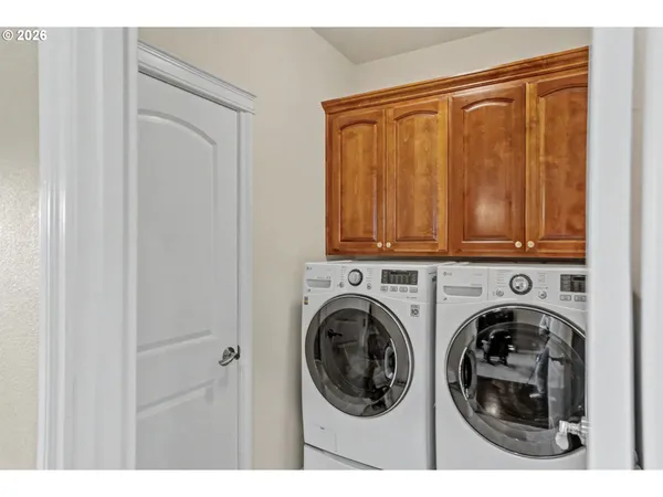 a view of a hallway with washer and dryer