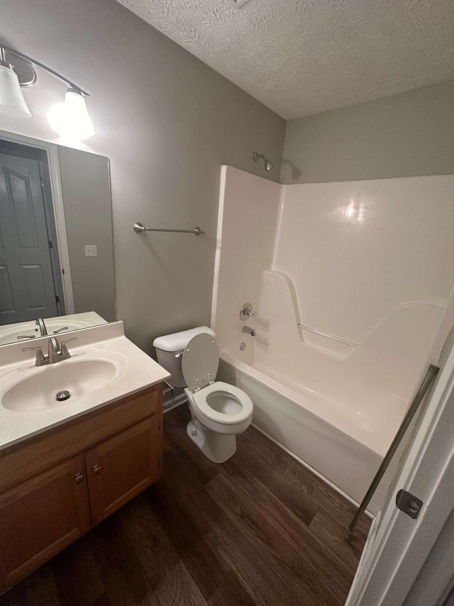 2434 Willowbrook Drive, Unit D Murfreesboro, TN 37130 - Photo 13 of 14 a bathroom with a sink a toilet and shower