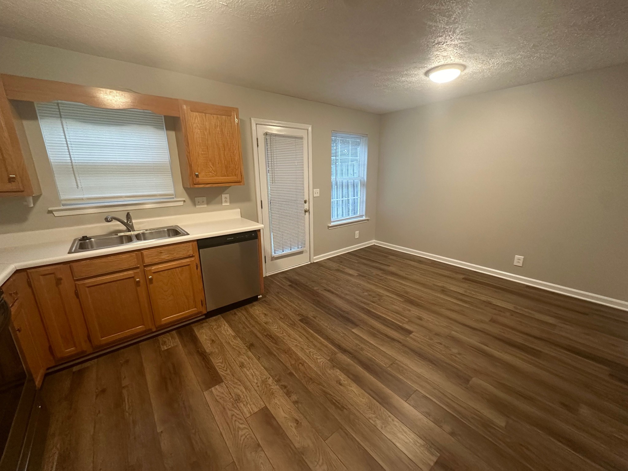 2434 Willowbrook Drive, Unit D Murfreesboro, TN 37130 - Photo 7 of 14 a view of a kitchen with wooden floor and a sink