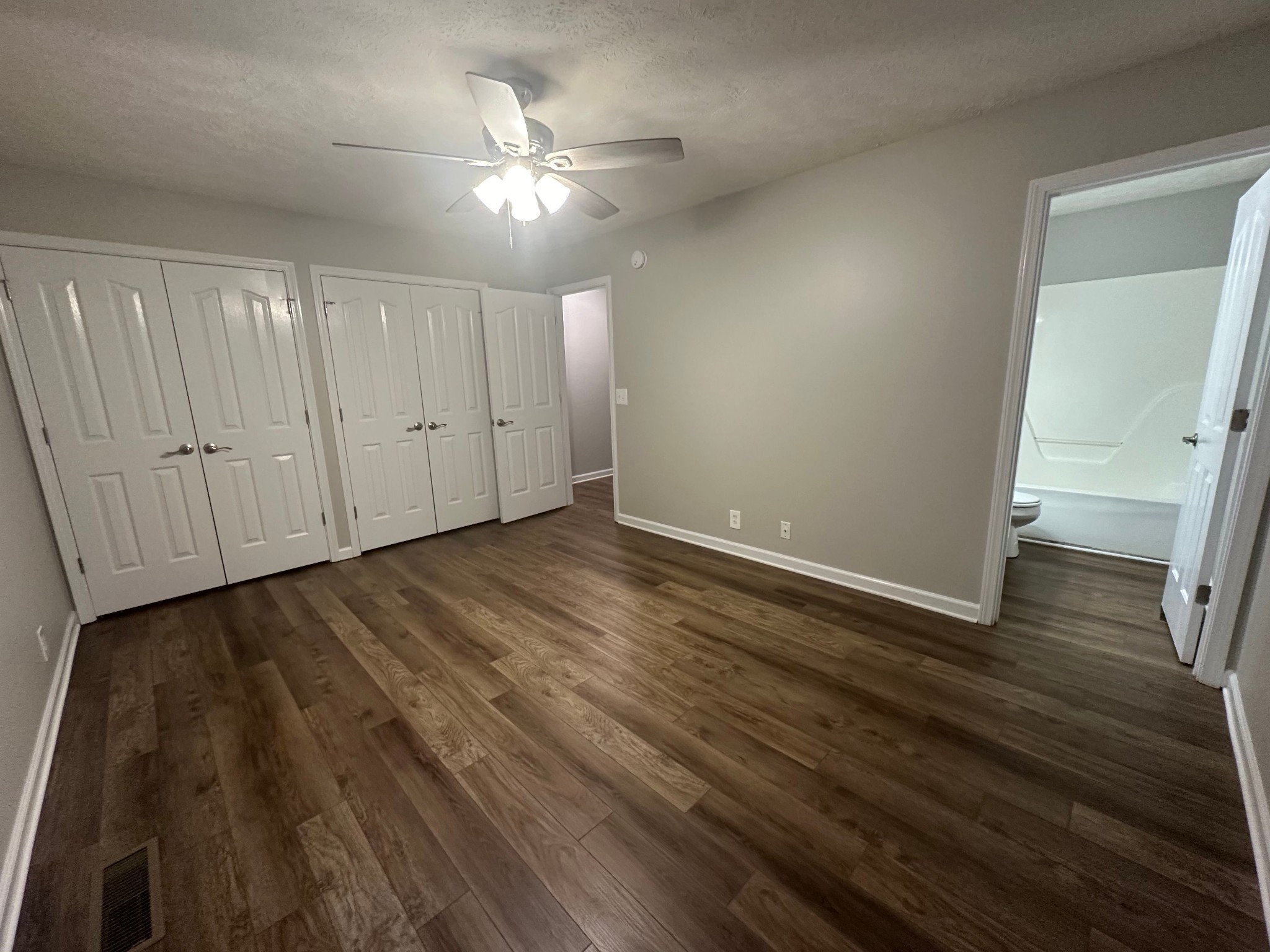 2434 Willowbrook Drive, Unit D Murfreesboro, TN 37130 - Photo 8 of 14 a view of an empty room with wooden floor