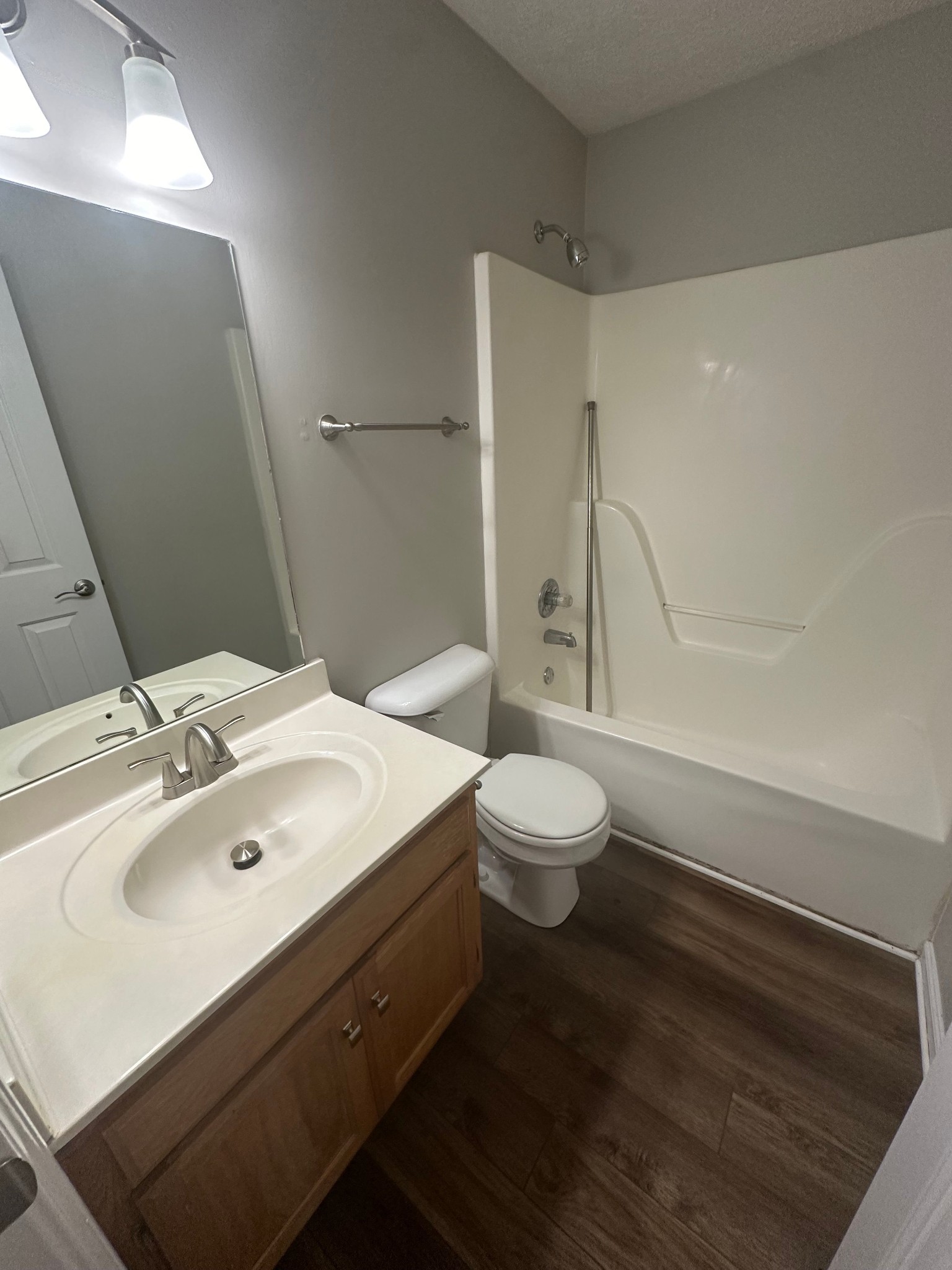 2434 Willowbrook Drive, Unit D Murfreesboro, TN 37130 - Photo 10 of 14 a bathroom with a sink mirror vanity and toilet
