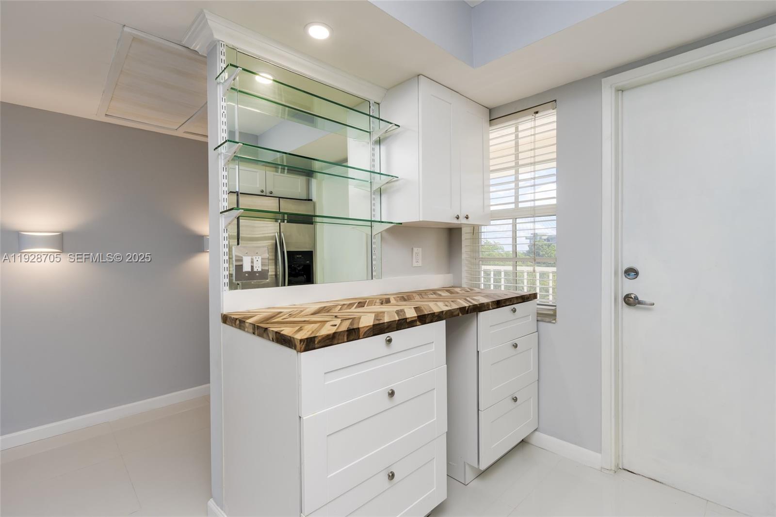 3090 North Course Drive, Unit 609 Pompano Beach, FL 33069 - Photo 14 of 36 a kitchen with granite countertop a sink and a stove