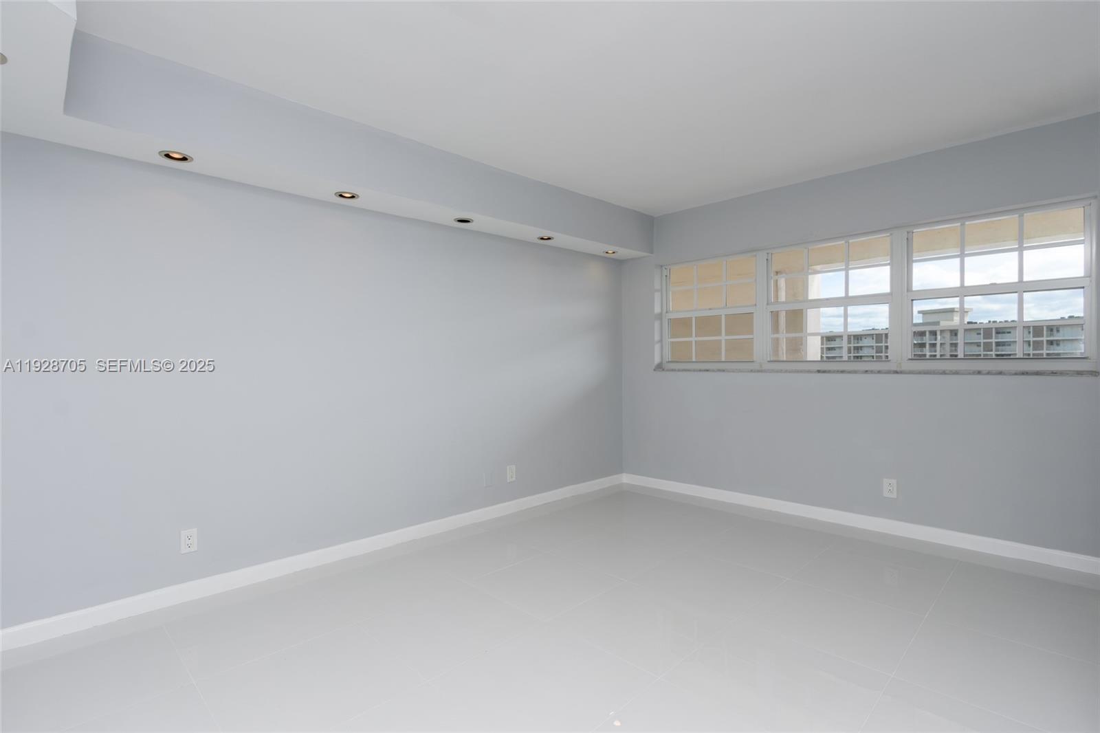 3090 North Course Drive, Unit 609 Pompano Beach, FL 33069 - Photo 17 of 36 a view of empty room with window