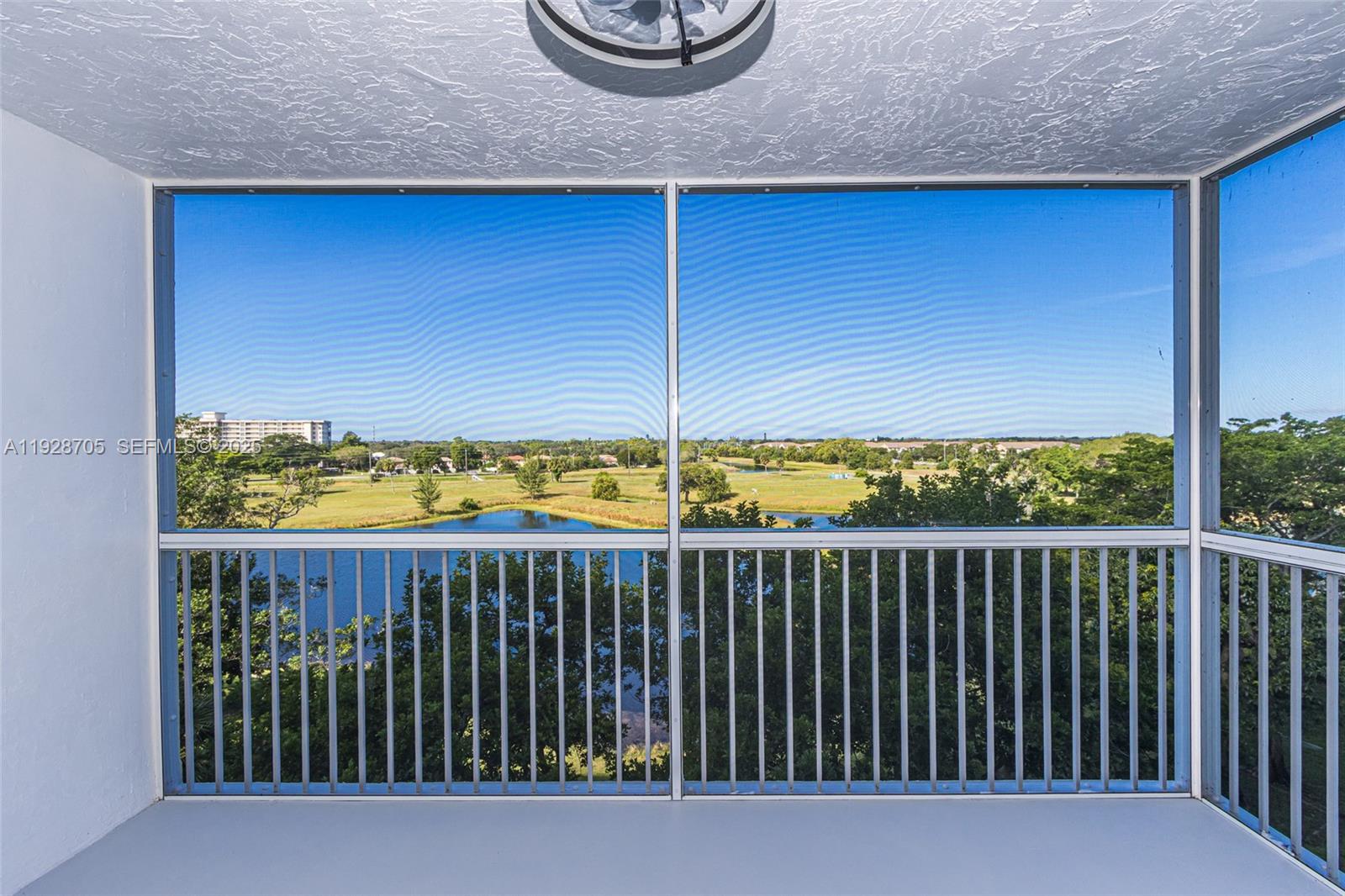 3090 North Course Drive, Unit 609 Pompano Beach, FL 33069 - Photo 30 of 36 a view of a balcony with wooden floor