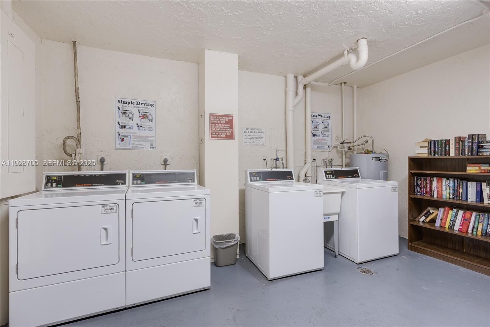 3090 North Course Drive, Unit 609 Pompano Beach, FL 33069 - Photo 33 of 36 a room with cabinets dryer and washer