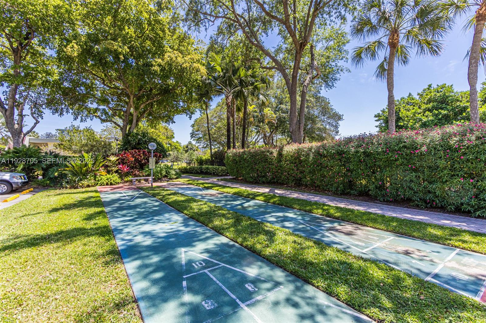 3090 North Course Drive, Unit 609 Pompano Beach, FL 33069 - Photo 35 of 36 a view of yard with swimming pool and green space
